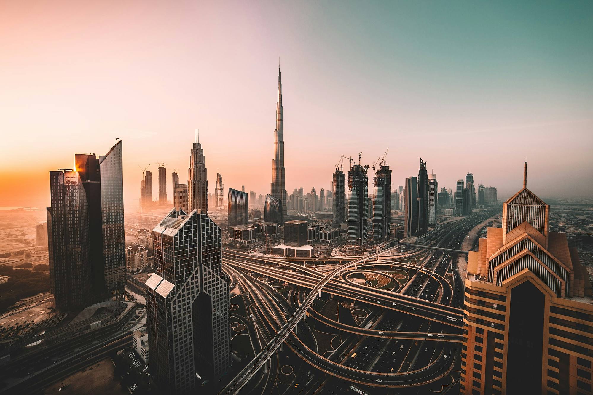 Downtown Dubai skyline with Burj Khalifa at sunset