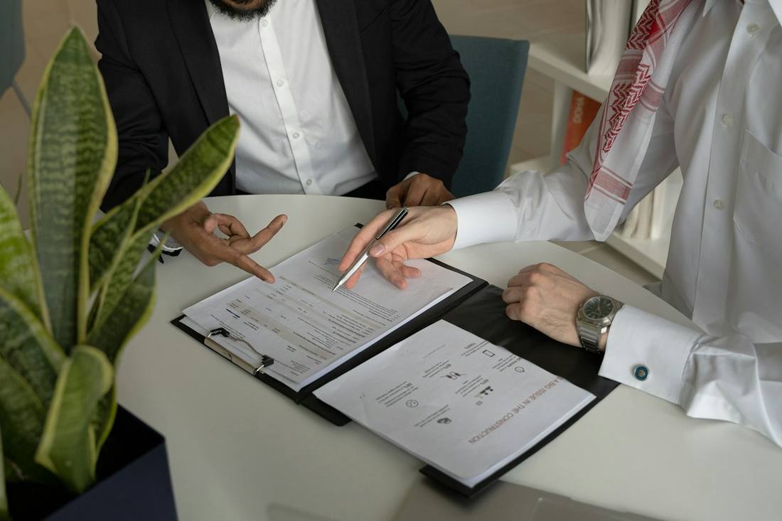 Moafaqa advisor reviewing application documents with a client