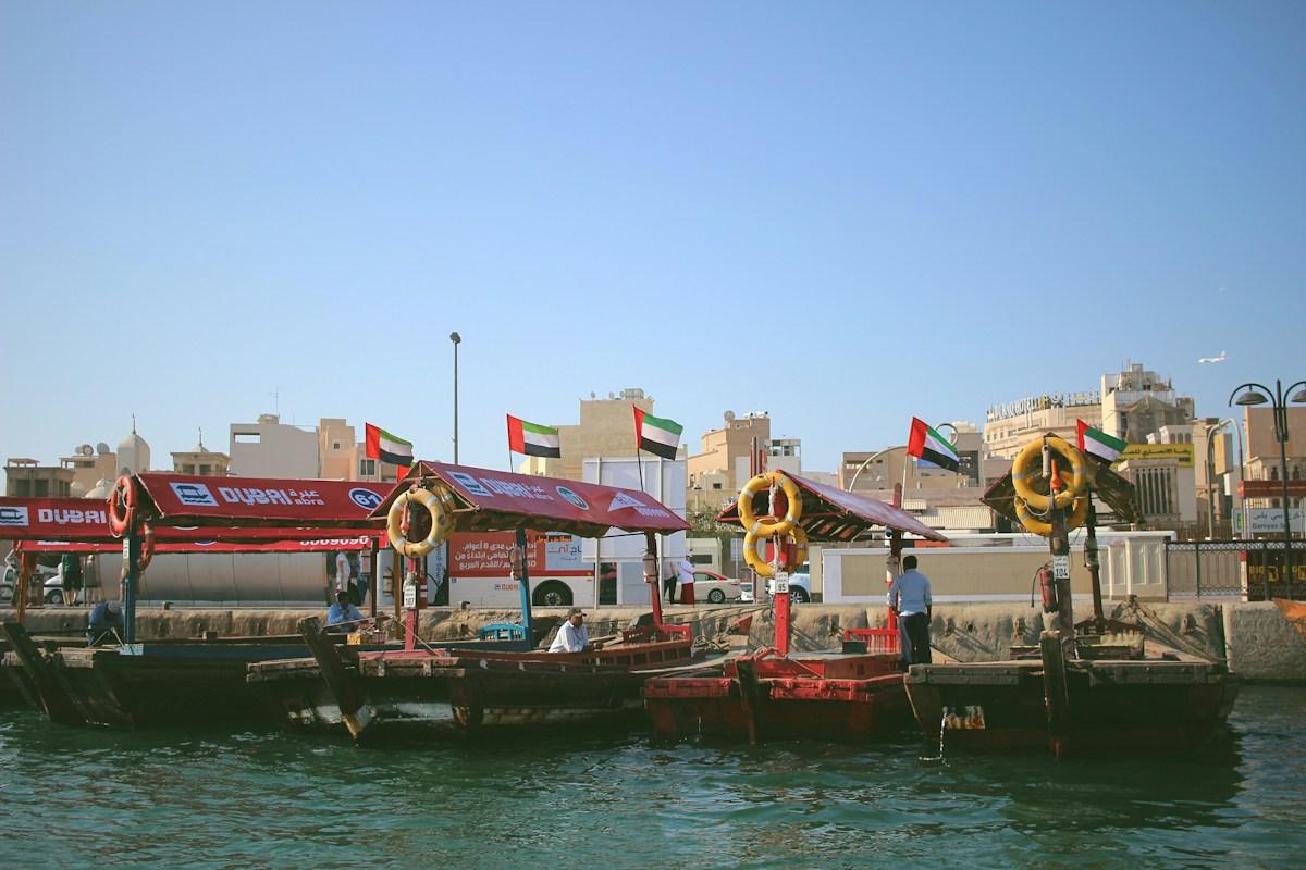 Abra boats with UAE flags on Dubai Creek